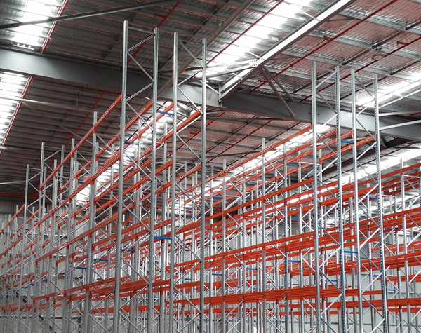 Newly installed selective pallet racking system in a large warehouse. Newly installed selective pallet racking system in a large warehouse.